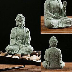 Meditating sandstone Buddha statue